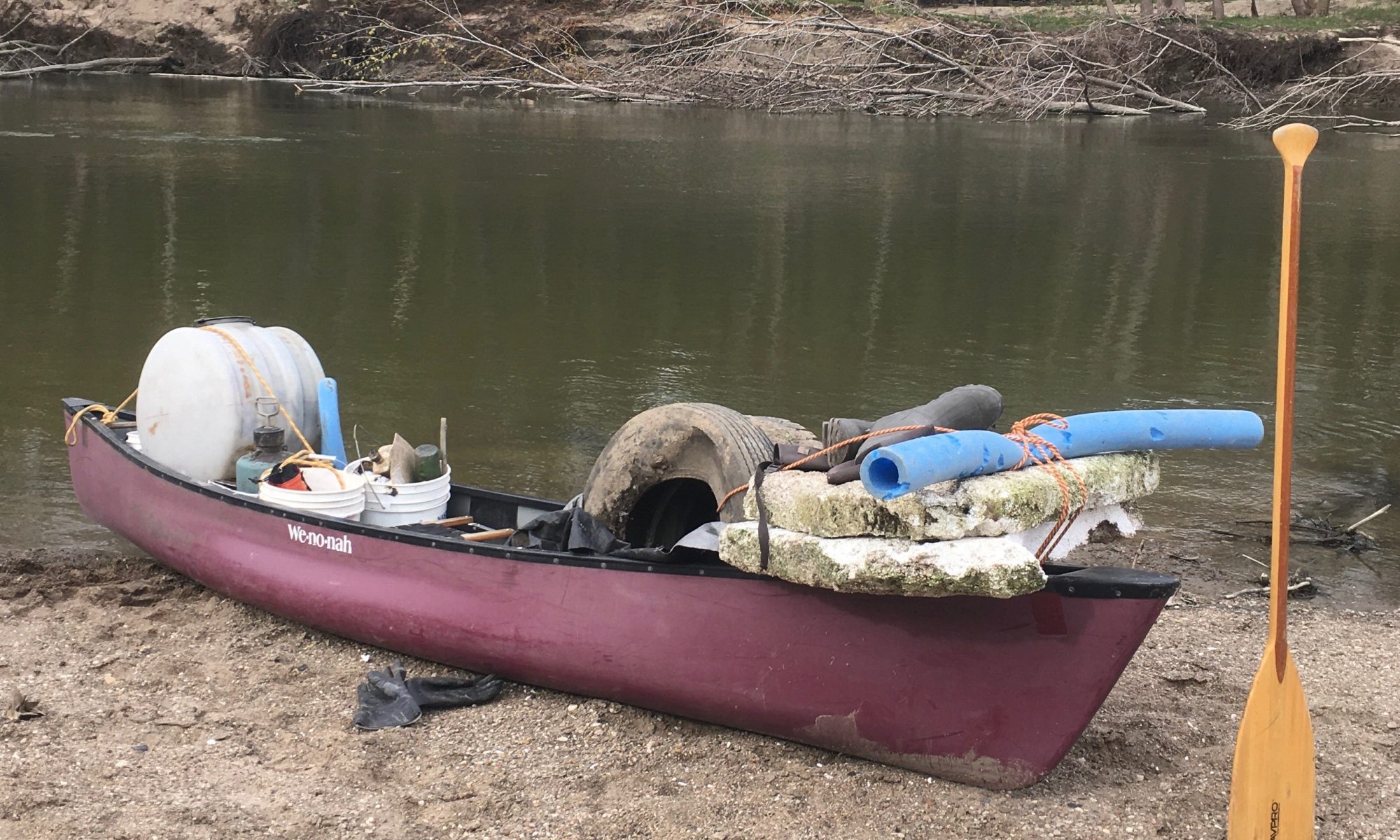 trash collected in canoe