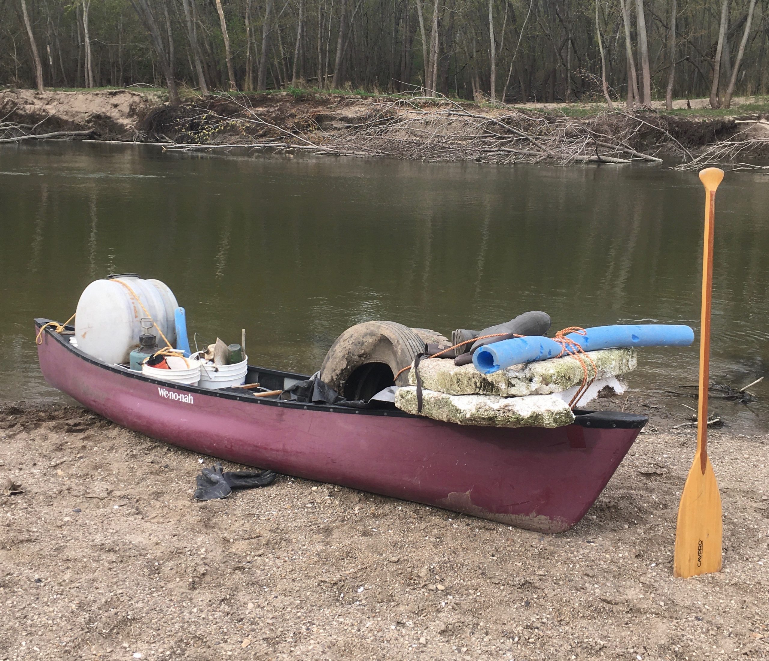 trash collected in canoe